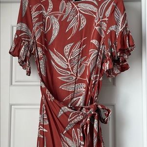 Worn once. Purchased from a local boutique perfect dress for fall with boots.